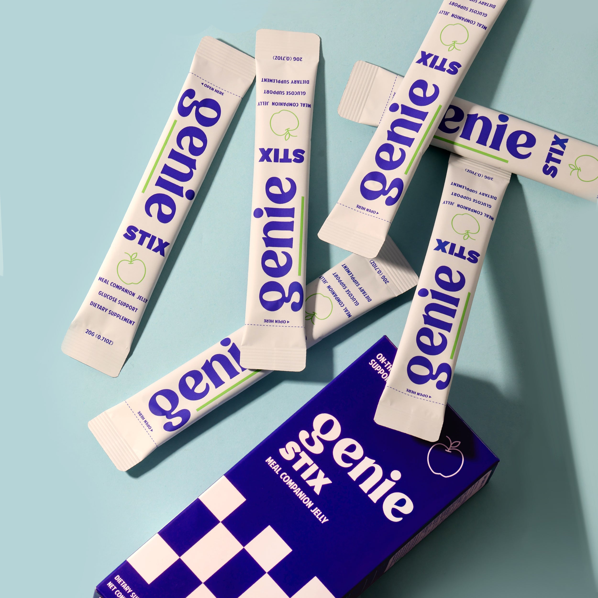 Multiple packages of Genie Stix on a blue background