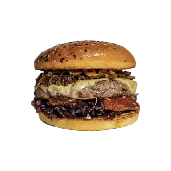 Burger with multiple layers of meat, cheese, and vegetables on a white background